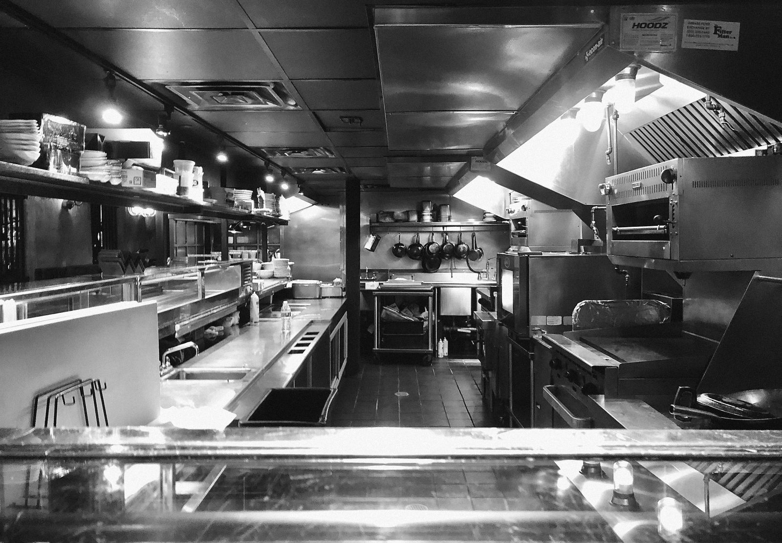 A dark kitchen seen across the pass