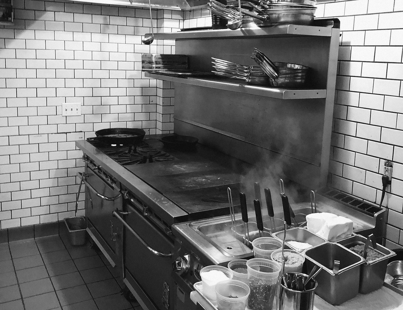 A kitchen line set with mise en place