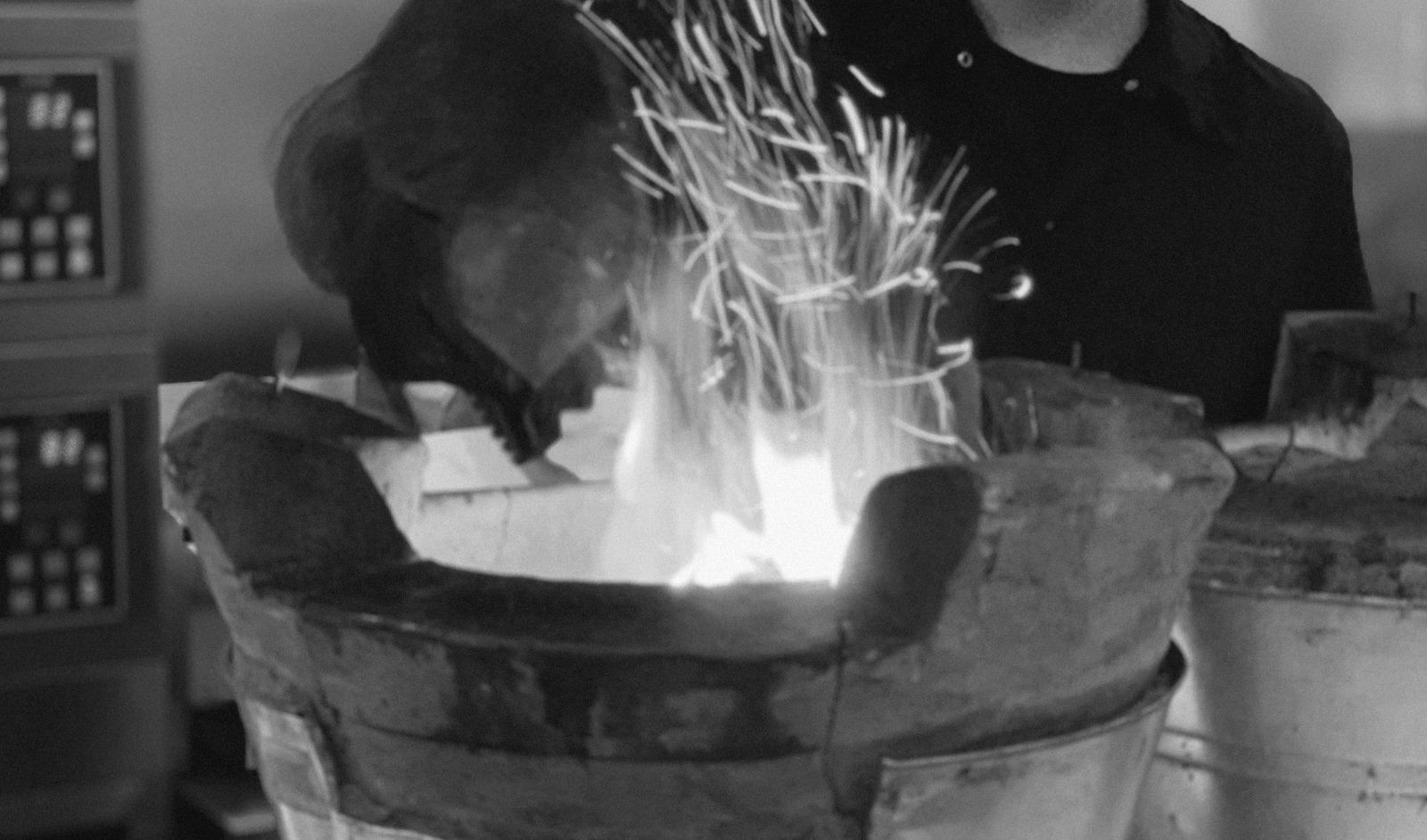 Sparks rising from a charcoal clay stove